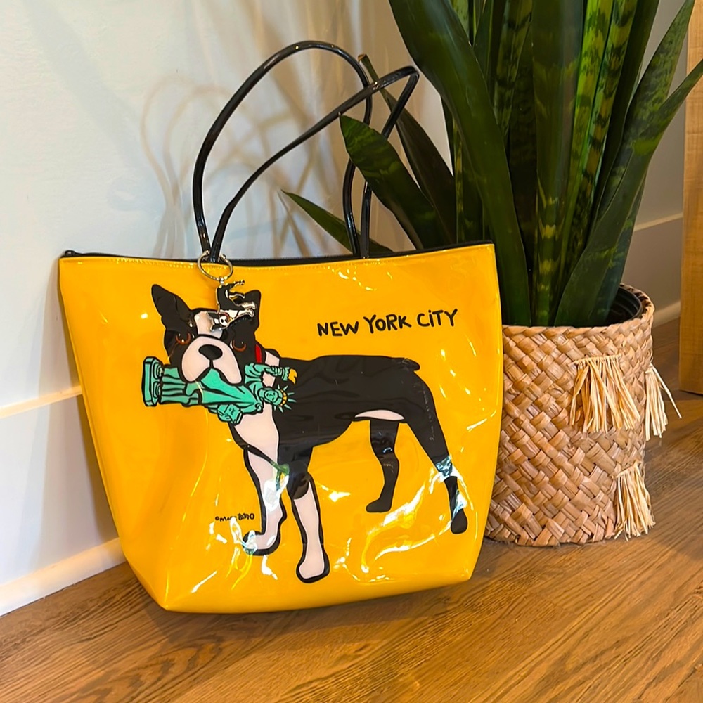 This is a yellow Marc Tetro bag with a keychain and extra bag included